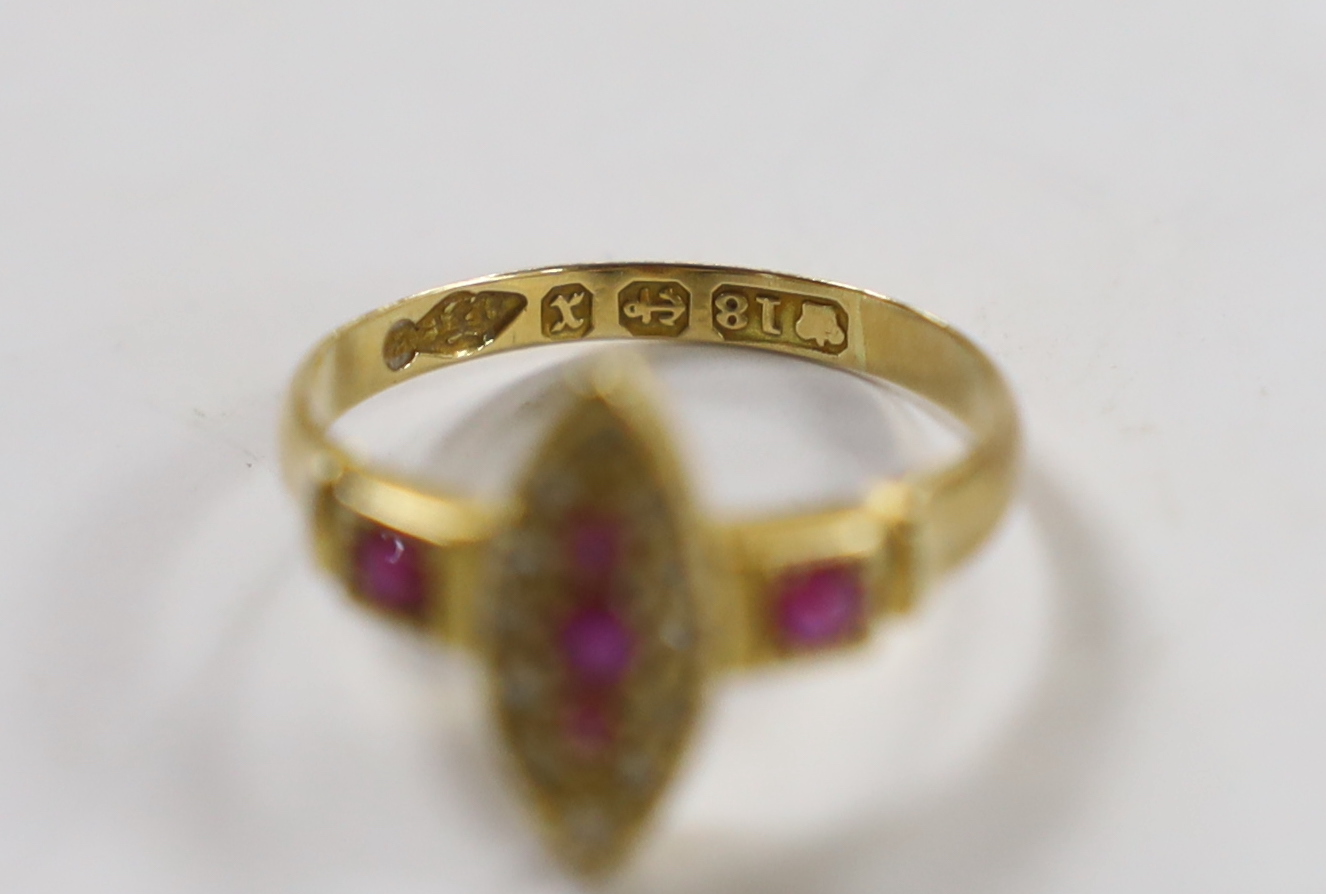A late Victorian 18ct gold, ruby and diamond cluster set navette shaped ring, size J, gross weight 2.4 grams.